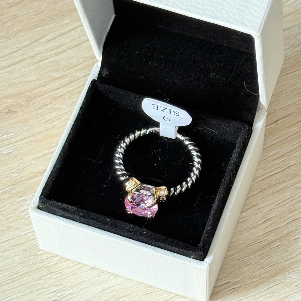 Elegant two toned ring with Pink CZ stone.